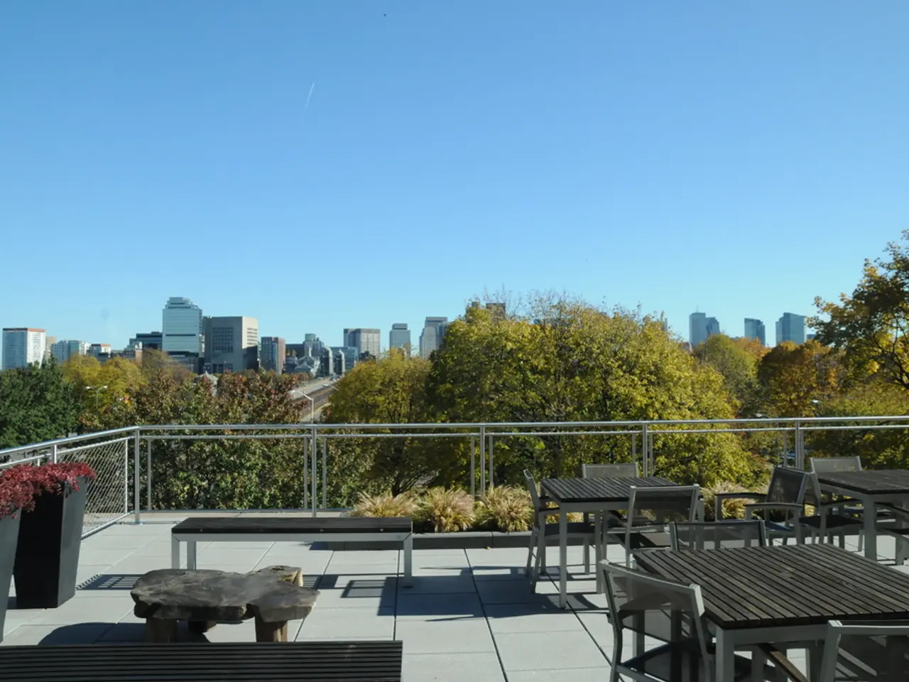 It seems to be the image is taken inside the restaurant. In the image there are table and chairs,...