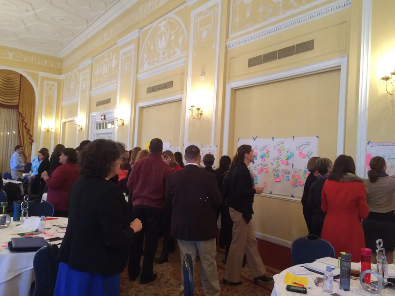 In the image there are many people looking at the posters and charts on the wall,this seems to be a...