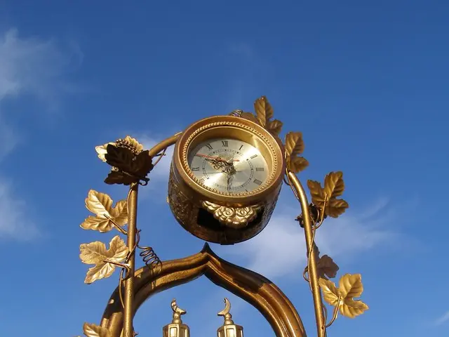 In this image we can see an arch with the clock. We can also see the depiction of a mosque. In the...