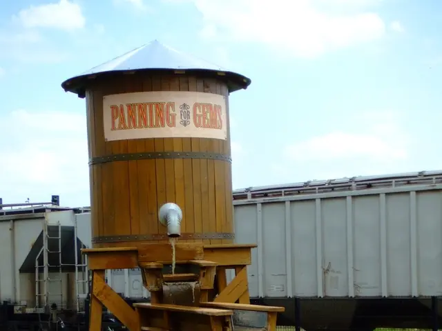 In this image we can see a train on the track, here is the grass, here is the water tanker, here is...