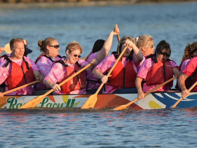 This picture shows few women and couple of men seated on the boat and in the water and we see few...