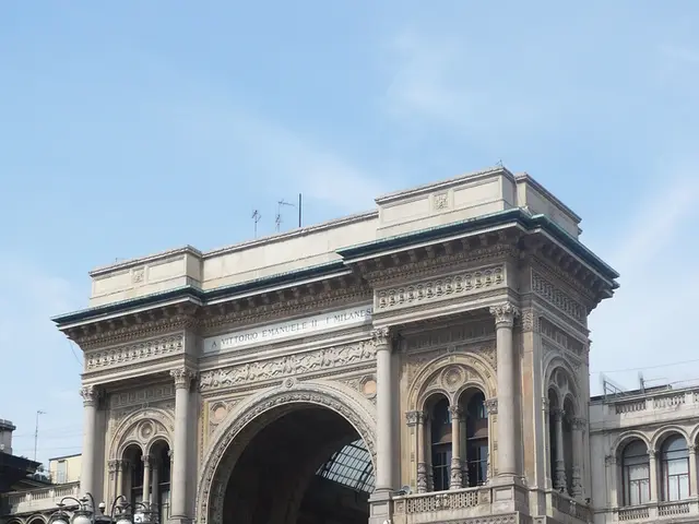 In the picture we can see a gateway of the palace with a art and pillars to it and near it we can...