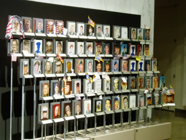 As we can see in the image there is wall, few flags and photo frames.