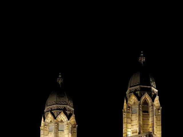 In this picture i can see the church. On the church there are two towers. At the top of the tower i...